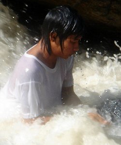 Swimming in hiking poncho